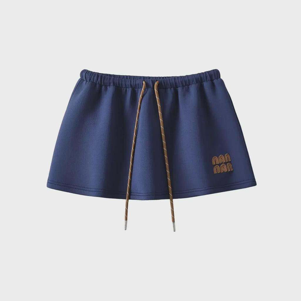 "Sweet Sports Style Mini Skirt: Elastic Waist, Air Layer Embroidery, Anti-Exposure, Versatile Sweater Material for Women."