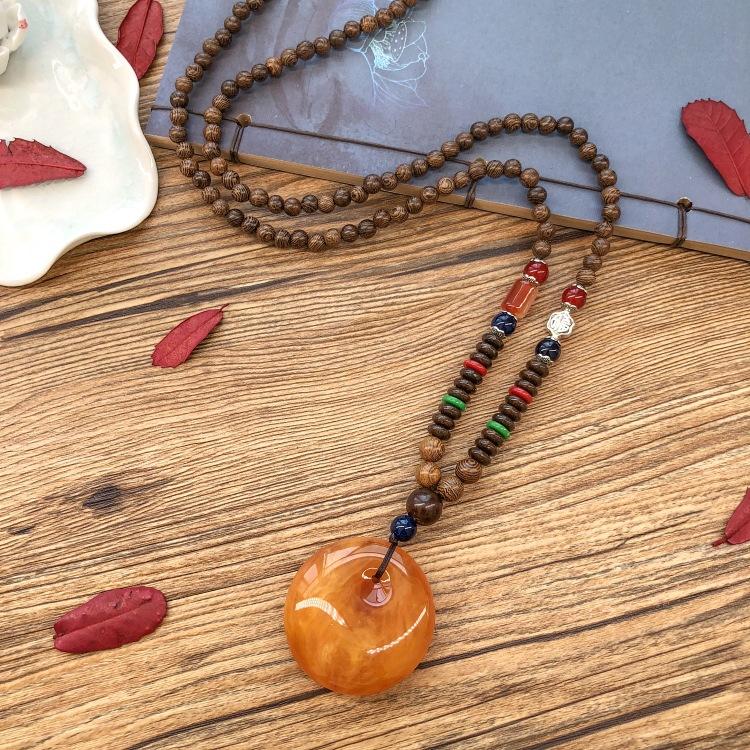 Retro chicken wing wood second generation old beeswax necklace men and women versatile amber pendant long sweater chain pendant