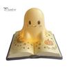 Ghost Figurine Desk Lamp Magic Book Night Light, Resin Tabletop Warm Glow with Moon Soft Yellow Light Star Relief, Cute Bedside Sleeping for