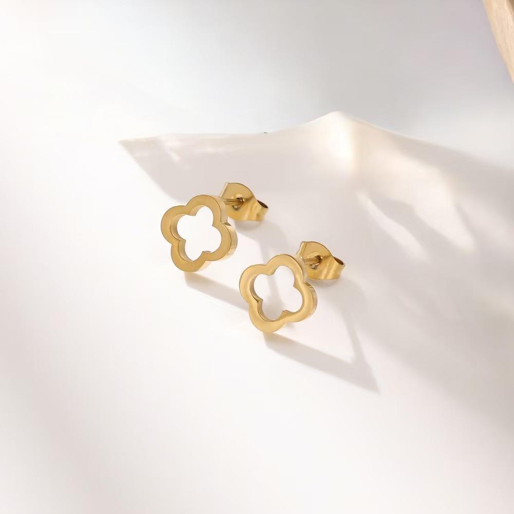 18K Gold Four-Leaf Clover Jewelry Set: Necklace, Bracelet, and Earrings in Titanium Steel with Zirconia.