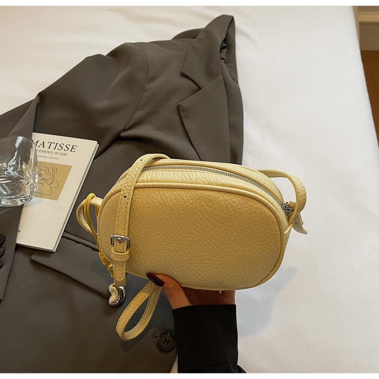 

Fashion versatile round small bag women s 2025 new shoulder messenger bag solid color casual large-capacity mobile phone bag women жёлтый