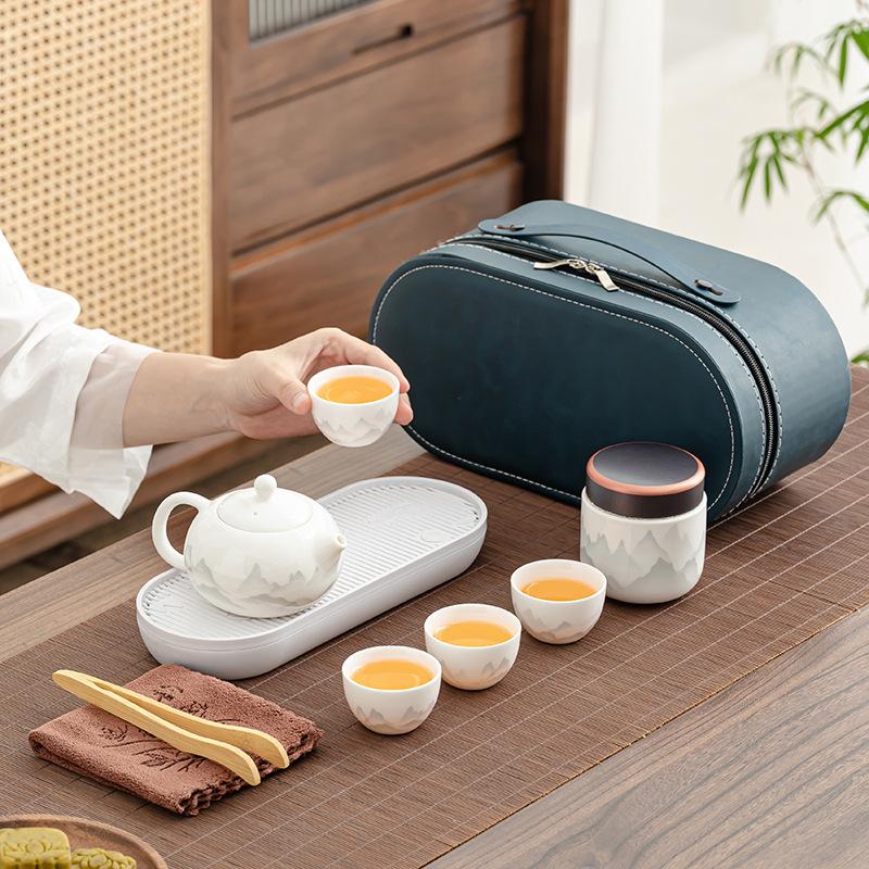 1011 New Travel Tea Set, Light Luxury and Portable, One Pot and Four Cups of Ru Kiln Car Express, Free Business Gifts