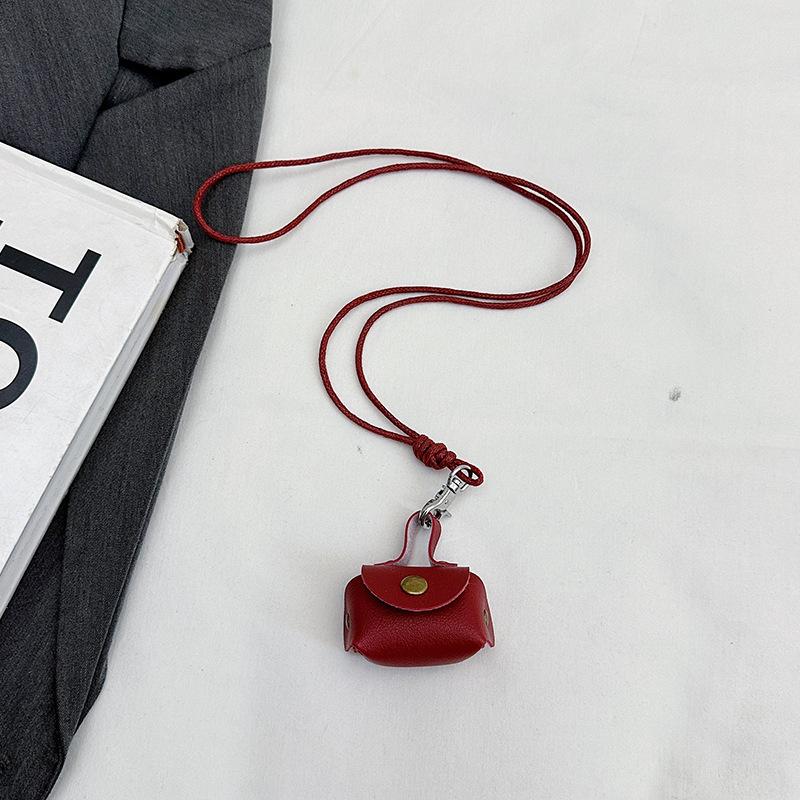 This year, it is super popular. Leather earphones, bags, neck hanging, hand carrying women's mini storage accessories, small bags, pendant keychains.