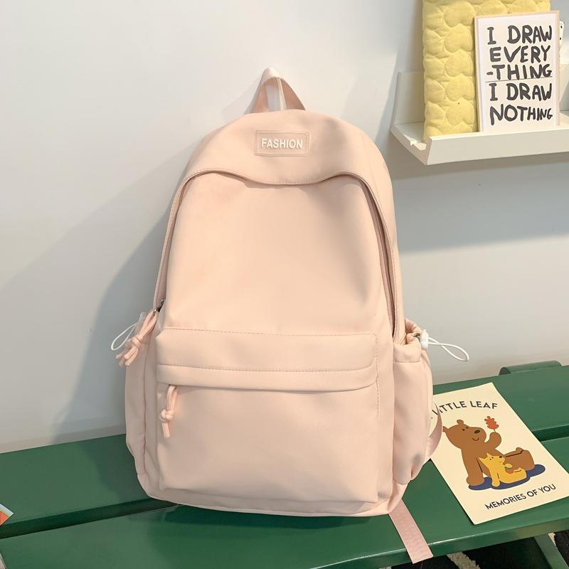 The schoolbag is fresh and sweet, and the solid color is versatile and simple. The schoolbag for junior high school students is light