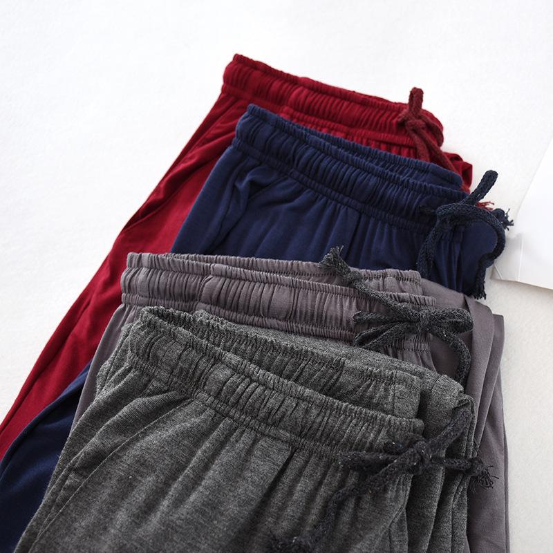 Pánské tenké pyžamové kalhoty měkké kalhoty chladivé stahovací elastické kalhoty na spaní volné tepláky s kapsami prodyšné ležérní kalhoty na atletickou jógu pro muže