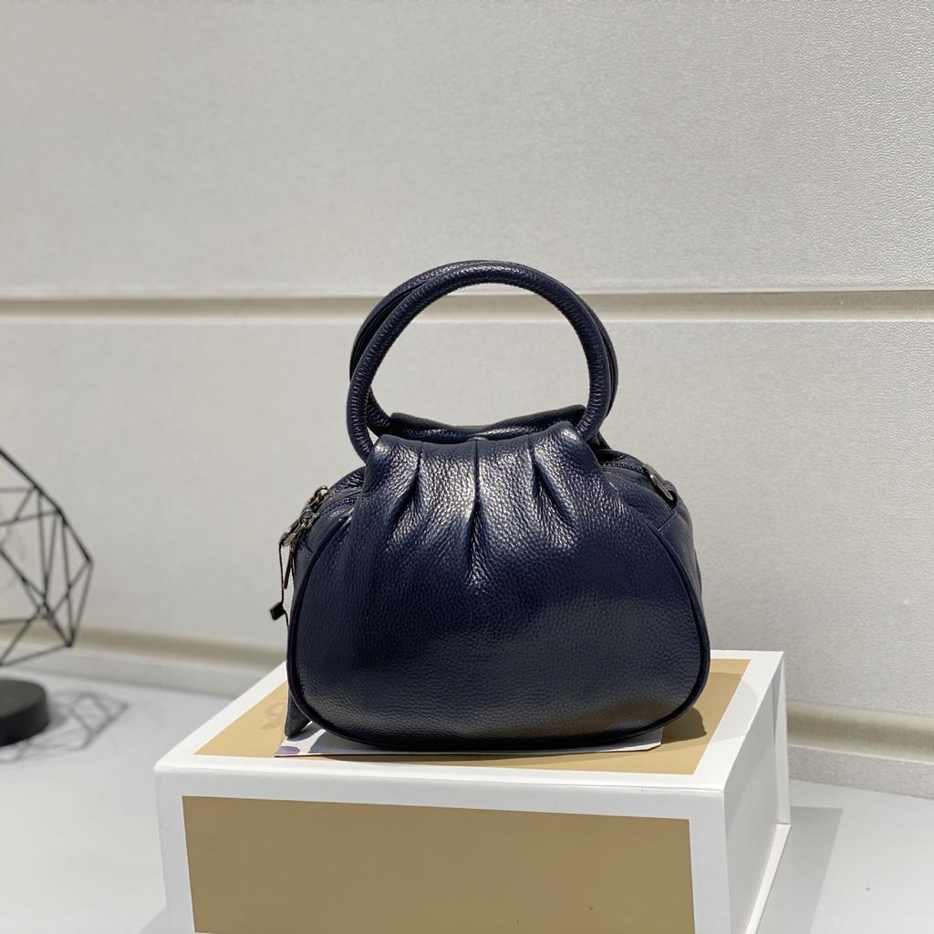 Bolsa Feminina de Couro Genuíno 2025 Nova Retrô Couro Bovino Camada Superior Bolsa de Mão Simples Versátil Tote Fabricante