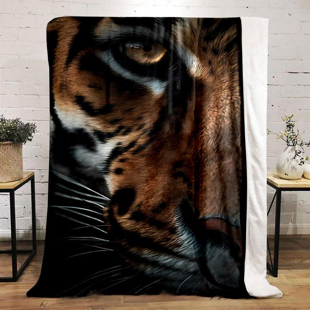 Close-up of tiger's face with striped fur pattern and piercing eye. for all seasons blanket lunch break throw gift