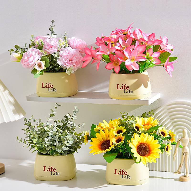 Living Room Decor: Artificial Sunflower and Green Plant Arrangements, Small Potted Plants, and Plastic Bouquets