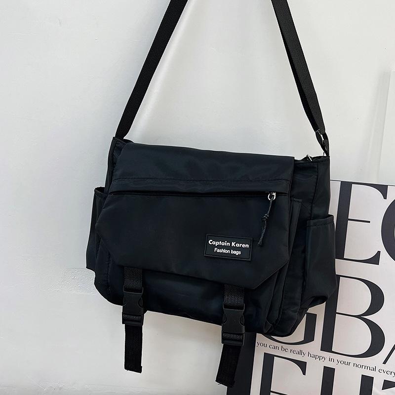 Large capacity tooling multi-pocket messenger bag leisure student shoulder versatile messenger bag solid color anti-splashing women's bag