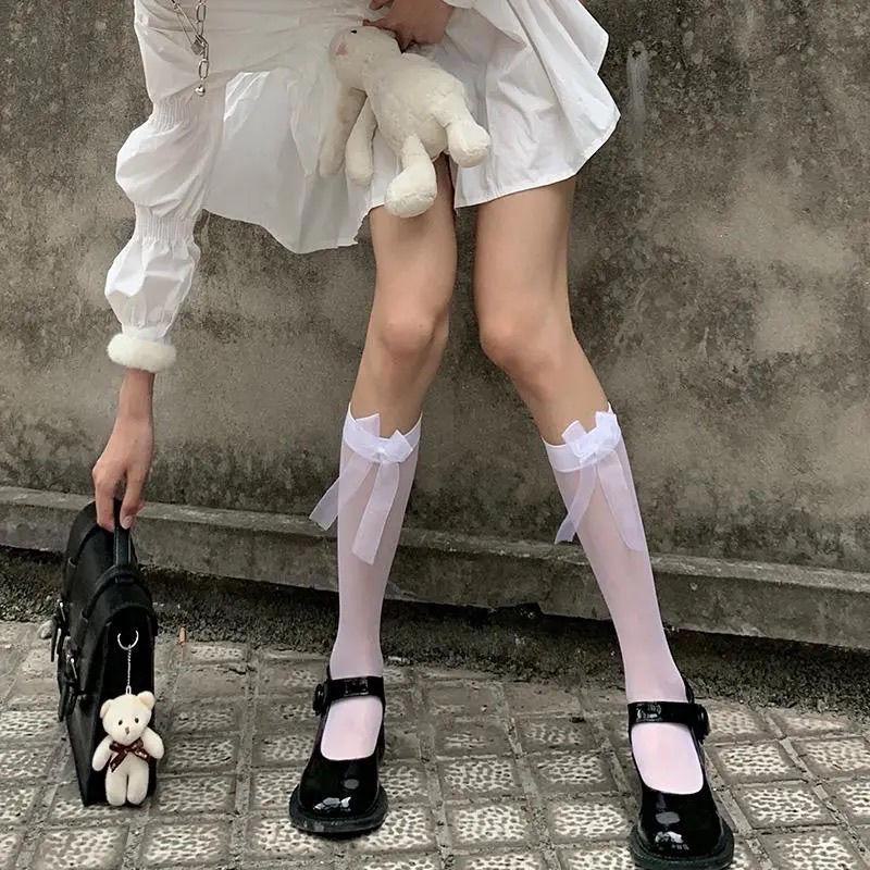

Белые носки из телячьей кожи - гольфы JK College Style с черным бантом thin middle socks чёрный