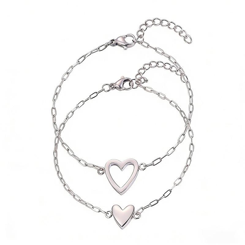 Simple and non-fading titanium steel hollow pull love couple advanced sense two-piece set casual versatile