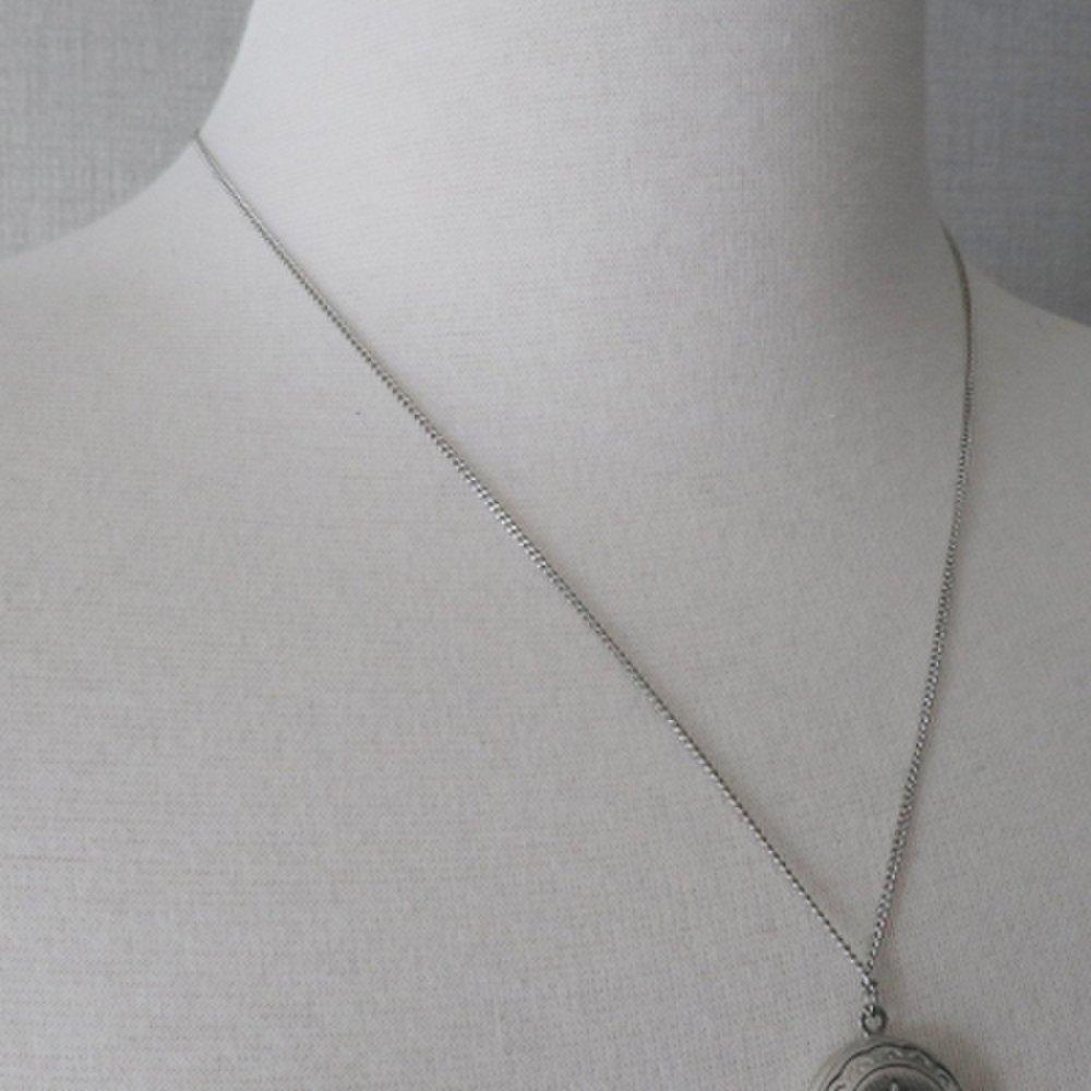 Silver round locket necklace with photo insert opening