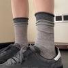 Grey Socks with Rolled-up Edges, Piles of Socks, Burken Shoes, Mid-calf Socks, and Contrasting Long Socks Are Trendy