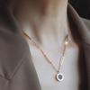 Black & White Titanium Double-Sided Roman Numeral Clavicle Chain with Mother-of-Pearl Pendant Necklace for Women.