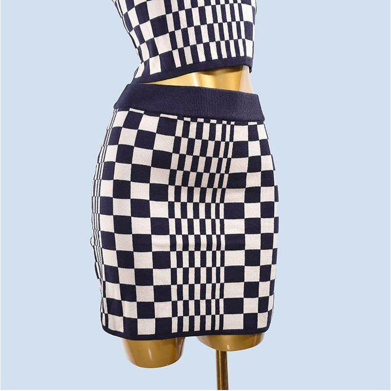 

Экспорт Однотонный Сексуальный Контрастный Короткий Топ Жилет Свитер + Юбка Комплект из двух предметов Navy Blue Gingham Single Skirt XS