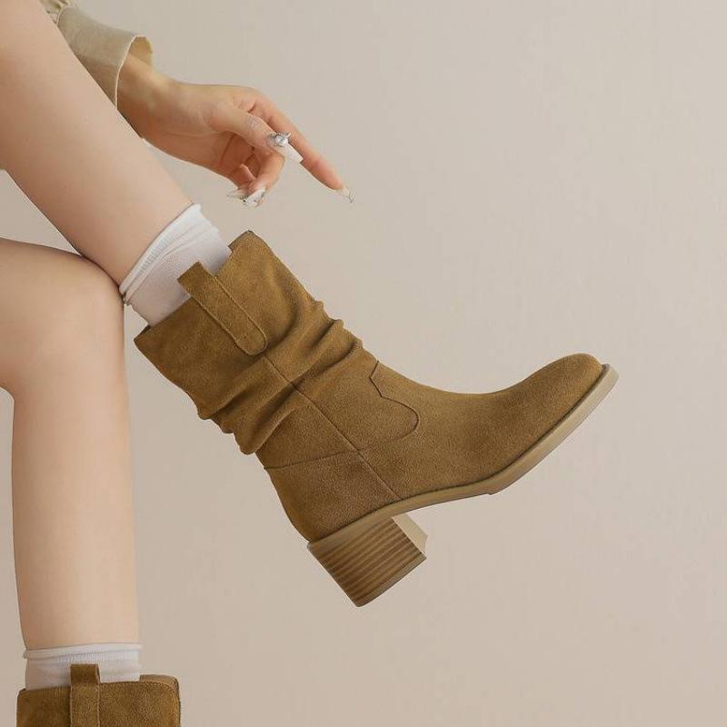 

Autumn and winter cowhide medium boots round head large size women s boots versatile sleeve rubber sole new leather middle heel Martin boots 40