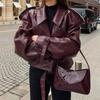 Women's Burgundy Faux Leather Jacket with Exaggerated Shoulder Design and Buckle Details
