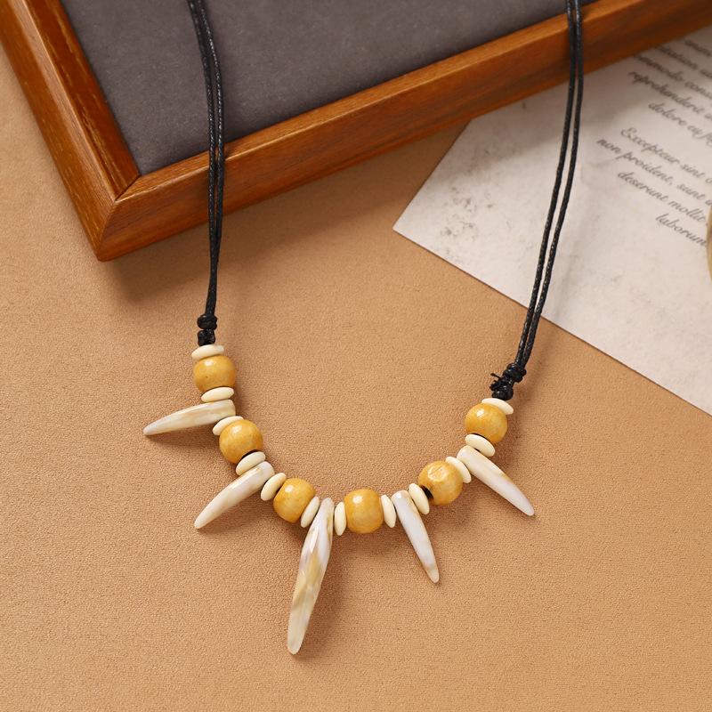 Hand-woven imitation wolf tooth wood bead necklace, retro niche dog tooth tribe men's and women's personalized sweater accessories