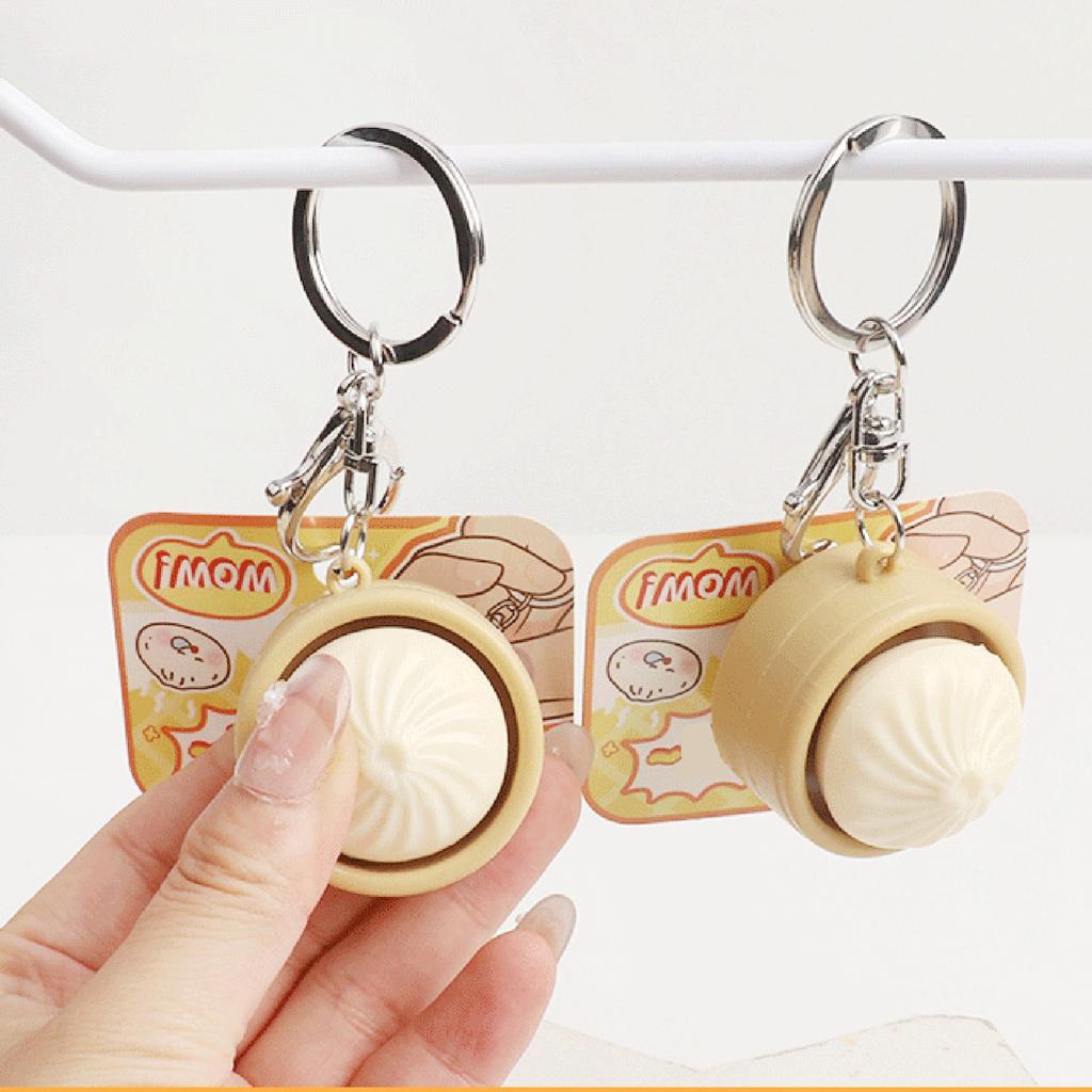 Niedlicher Schlüsselanhänger mit simuliertem gedämpftem Brötchen und Knopf-Dekompressionfunktion, Kreatives Geschenk