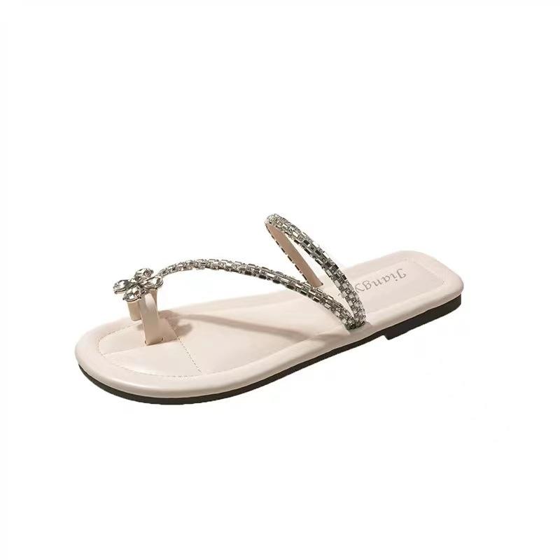 Franse kleine coole slippers met platte zool dames 2025 nieuwe zomer zachte zool met strass steentjes mooie strandsandalen vismond