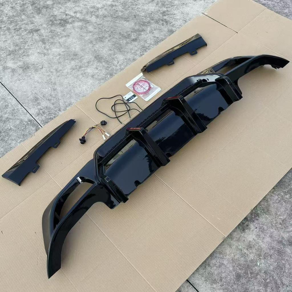 Fit for BMW 3 Series 20-22 G20/G28 Gloss Black Carbon Fiber Rear Diffuser with Dual Vertical Lights.