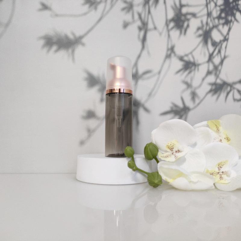 Available 60ml Transparent Black Foam Mousse Bottle for Face Wash and Travel-friendly Cosmetic Packaging.