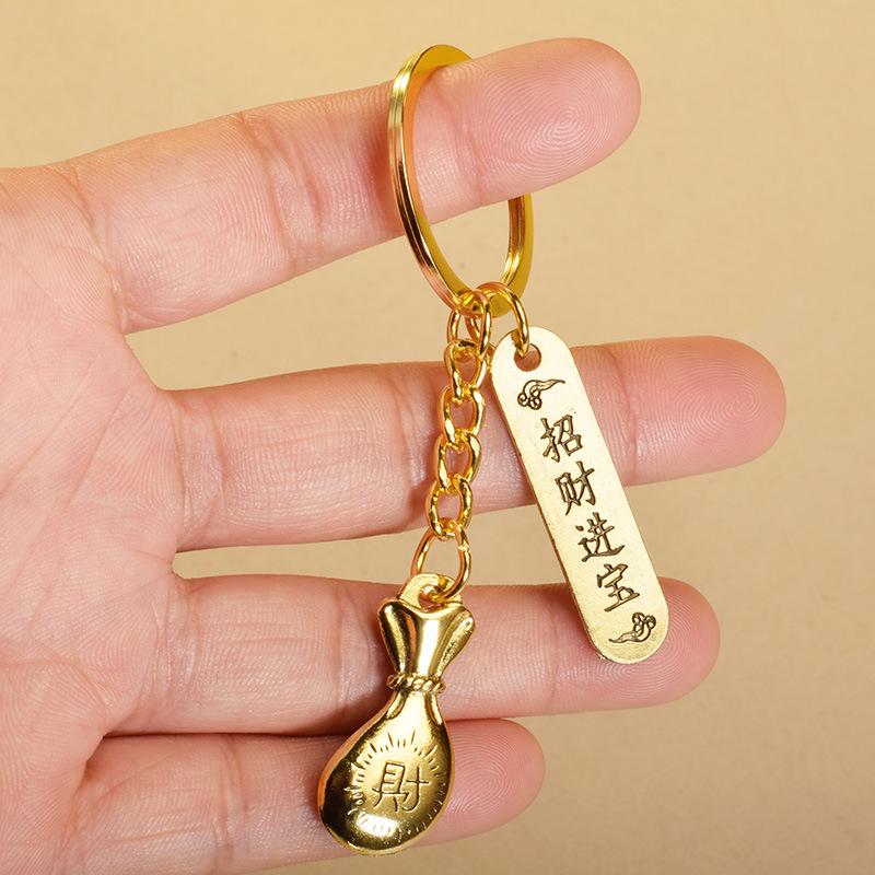 Nøkkelring, Lommebok, Baifu-krukke, Eple, Pixiu, Støvbrett, Buddha-amulett, Bilnøkkelanheng, Naturskjønt suvenir, Gatebod, Nattmarkedsartikkel.