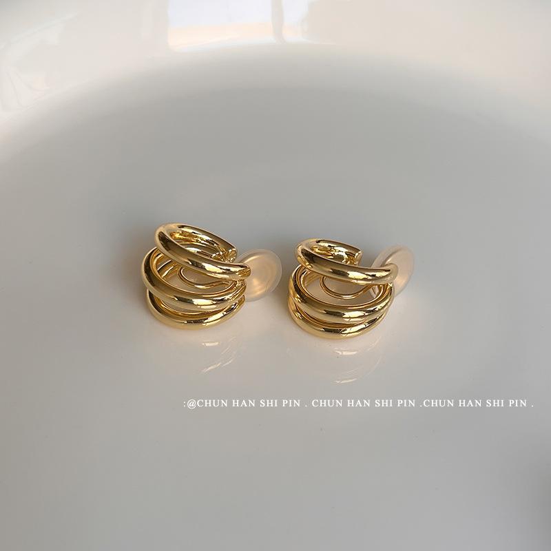 Retro curved metal sense mosquito coil disc ear clips without ear holes, women's high sense niche temperament versatile circle earrings