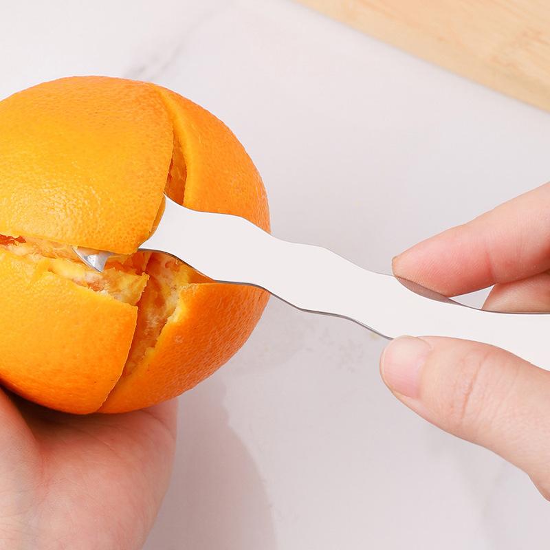 New Model Kitchen Appliance for Removing Peels From Fresh Fruits. Home-use Stainless Steel Device for Peeling Oranges and Grapefruits.
