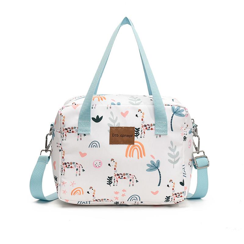 Single-shoulder slanted crossbody baby bag, cute cartoon design, large capacity, water-resistant, suitable for moms to carry out