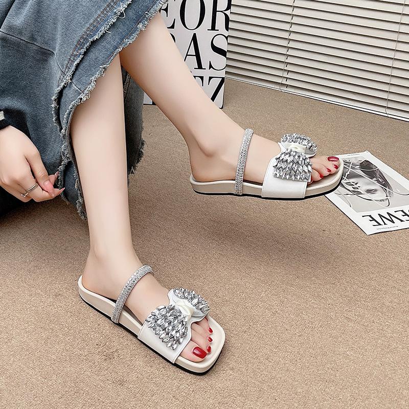Summer 2025 new thick-bottomed rhinestone bow cool slippers women's summer wear versatile with skirt French flat-bottomed drag
