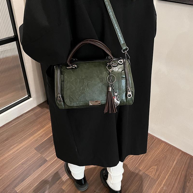 New fashion retro handbag large capacity soft leather Boston pillow bag fringed pendant women's bag