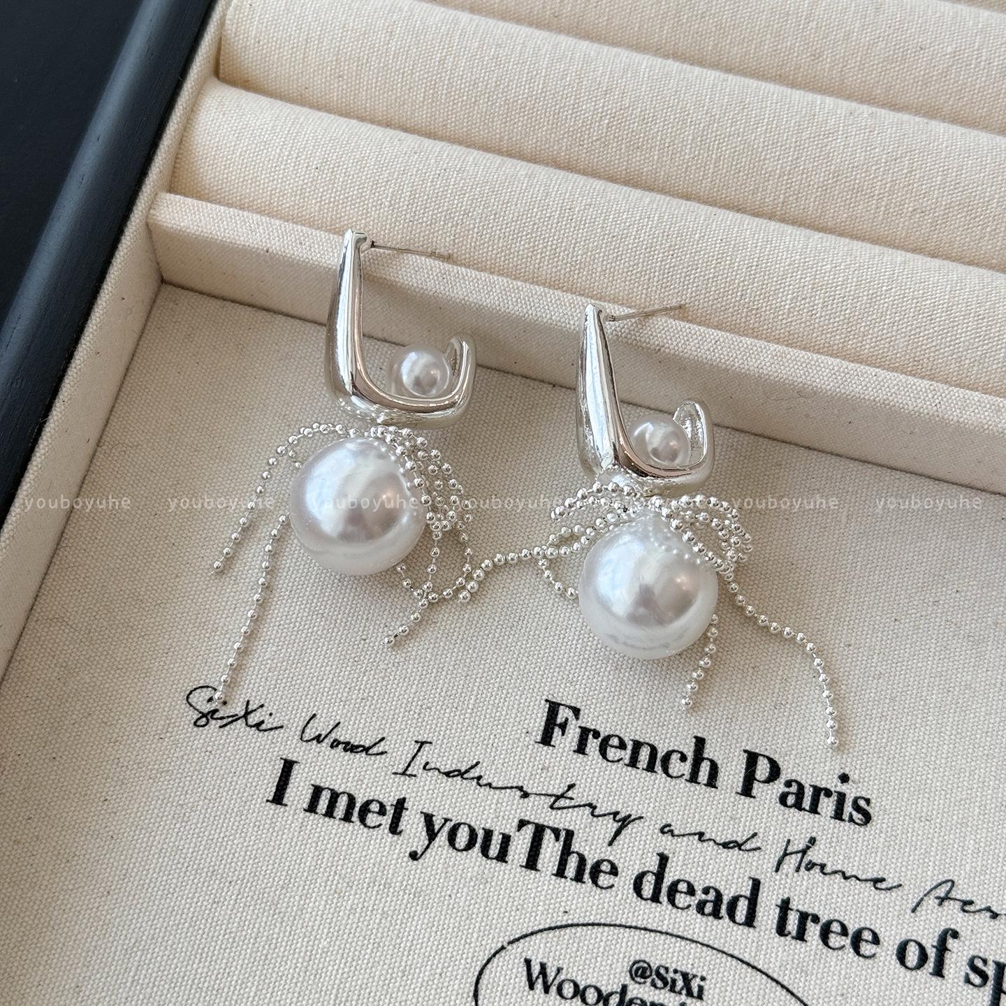 

Elegant Pearl Tassel Earrings for Women: Luxury Silver Studs, Unique and Noble