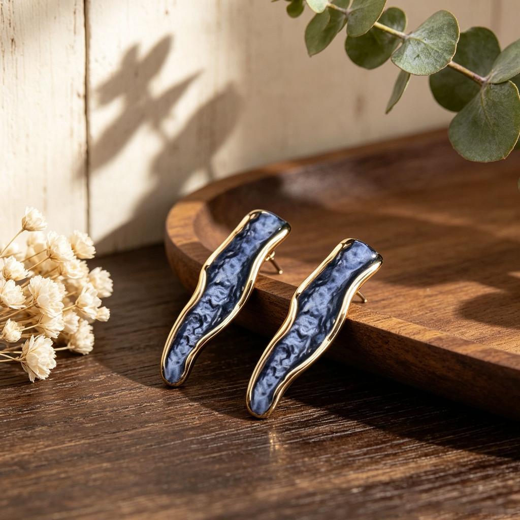 Popular hand-painted enamel stud earrings irregular geometric long strip wave commuting versatile light luxury earrings