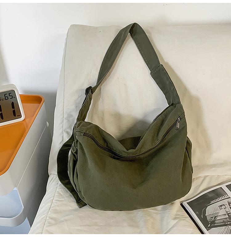 

New 2025 large-capacity casual men s and women s canvas dumpling bag sports wind light shoulder messenger bag зелёный