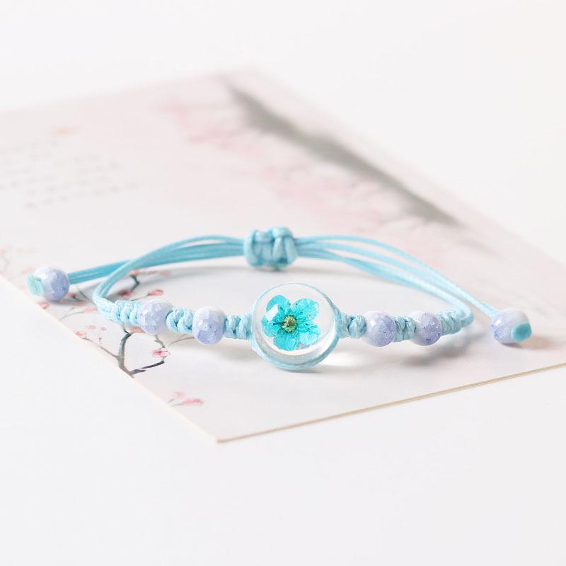 

Adjustable Cord Bracelet with Resin Encased Flower Beads Handcrafted Braided Design Lightweight Durable Jewelry for Everyday Wear One Size