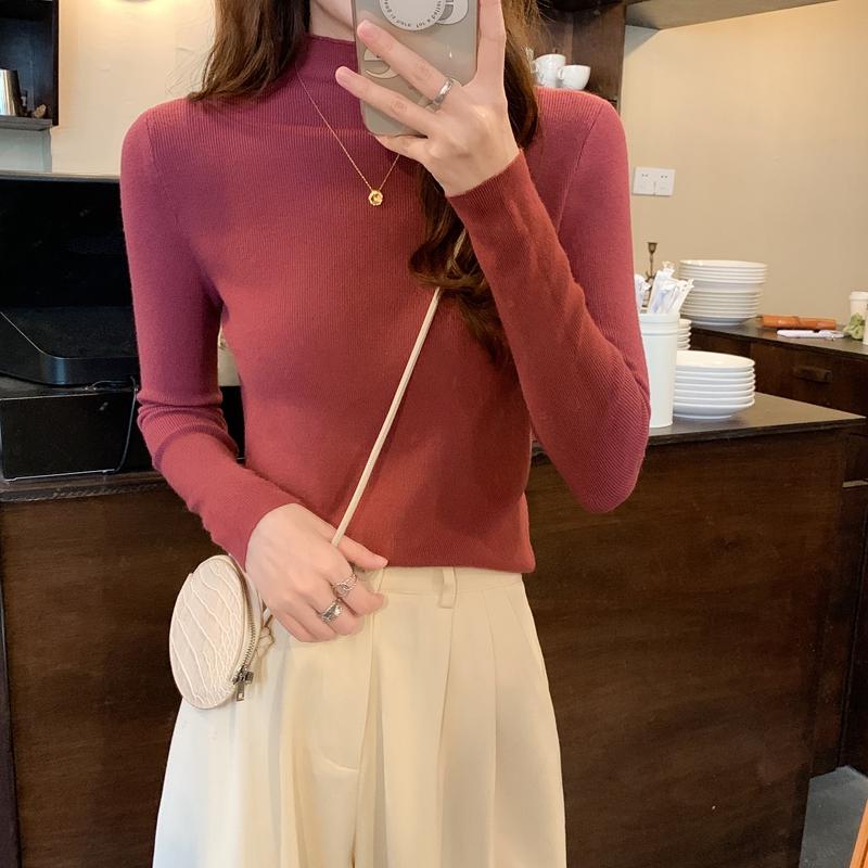Nuevo invierno ajustado tejido de punto Color sólido cuello redondo señoras moda camisa por el trasero suéter mujer ropa