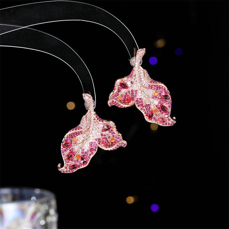 

Light luxury fashion high sense gorgeous petals curved leaf earrings tide bright zircon inlaid three-dimensional leaf stud earrings