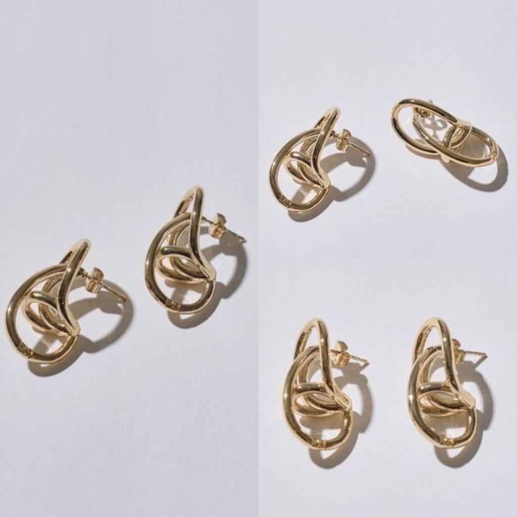 Used PHILIPPE AUDIBERT/gold twist loop earrings