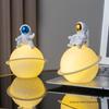 Astronaut Night Light Planet Lamp: Luminous Moon Ornament for Bedroom Decor, Gift, or Souvenir with Silk Flower.