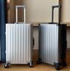 Aluminum-Magnesium Alloy Travel Suitcase with Leather, 20-Inch Carry-On, Aluminum Frame, and Universal Wheels.