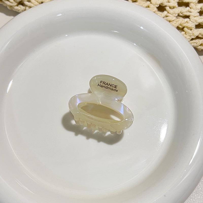 Acetate Floral Mini Claw Clip: Elegant Oval Hollow Design for High Ponytails & Side Styles