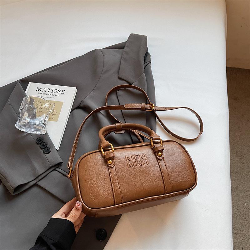 Niche retro portable pillow bag women's handbag 2025 autumn new fashionable high-value shoulder messenger bag