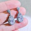 Fashion jewelry: full of diamonds, oval flower studs, exquisite temperament, earrings, light luxury, high-end earrings