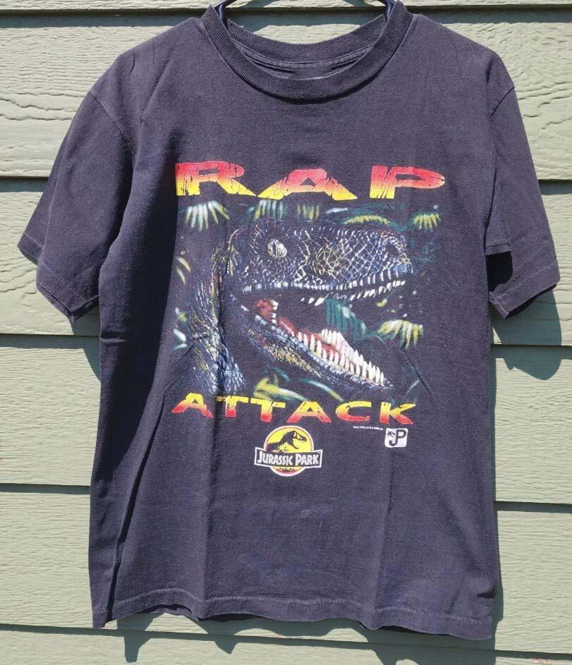 

VTG 1993 JURASS,IC PARK RAP ATTACK DINOSAUR MADE IN USA SIZE S-4XL Unisex T-Shirt L