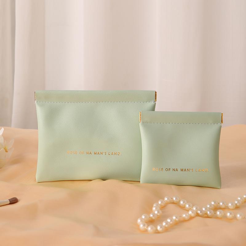 Portable Earphones, Charger, and Coin Storage Pouch with Auto Closure