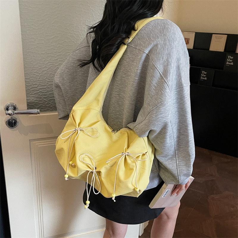 

Korean-style sweet bow nyl bag for women, large-capacity daily commuter shoulder and crossbody bag, versatile casual bag жовтий