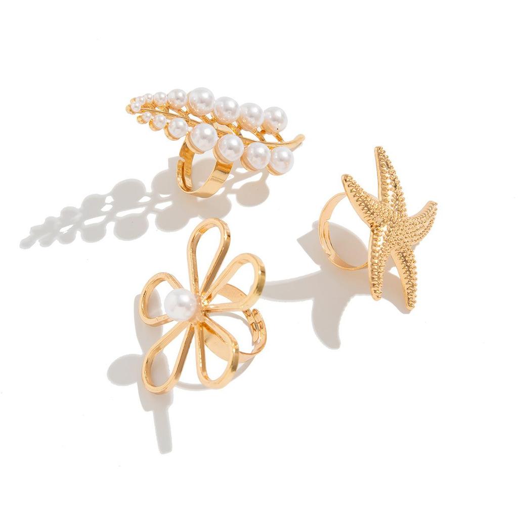 Mote stableslitasje Vind Uregelmessig legeringsringinnlegg Vindinnlagt perle dendritisk ringsett Enkel trend Høy sans for smykker for kvinner