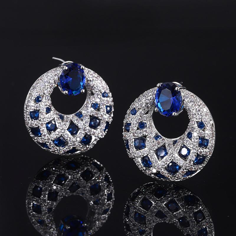 

Темпераментные женские серьги Цветные серьги-сокровища Инкрустированные имитацией сапфира Серьги Главный камень 8 * 10