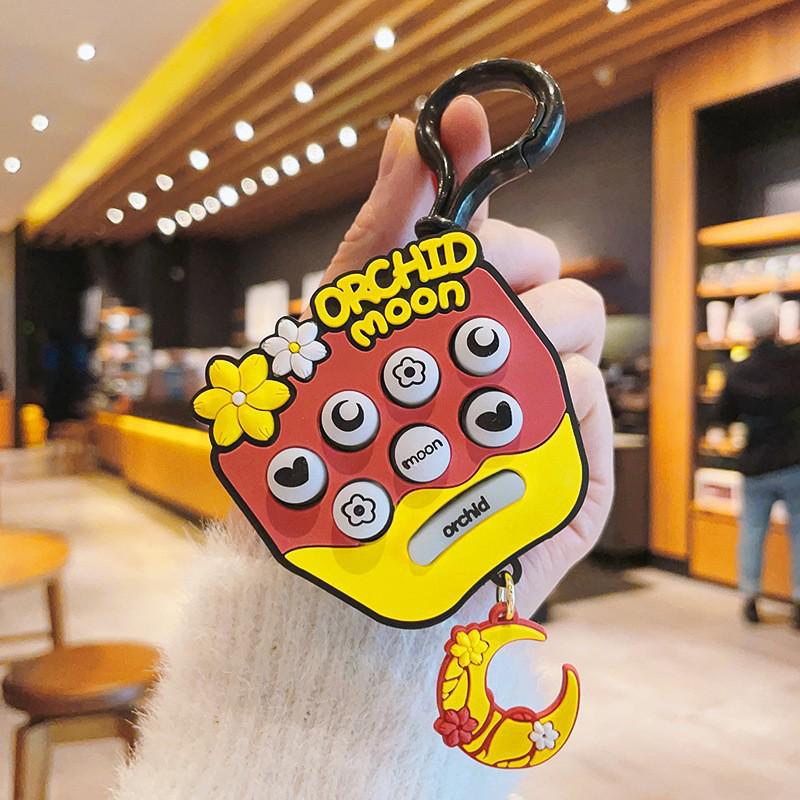 

Sakura Whack-a-Mole Mini Keyring Toy – Fun Decompression Game for Kids, Claw Machine Gift, Small Pendant вина червоного кольору